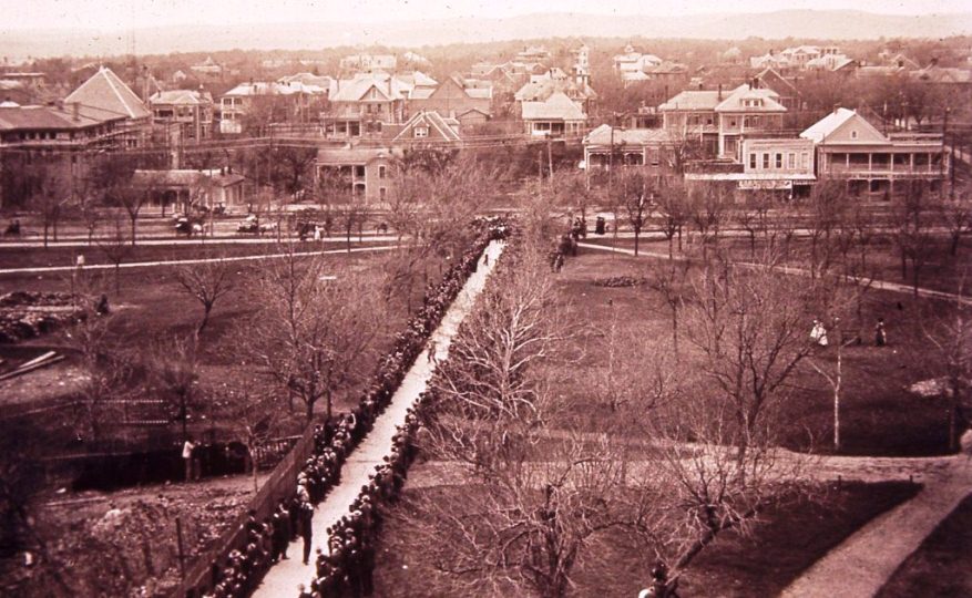 Texas legislators walk up future West Mall to Old Main for presentation and lunch