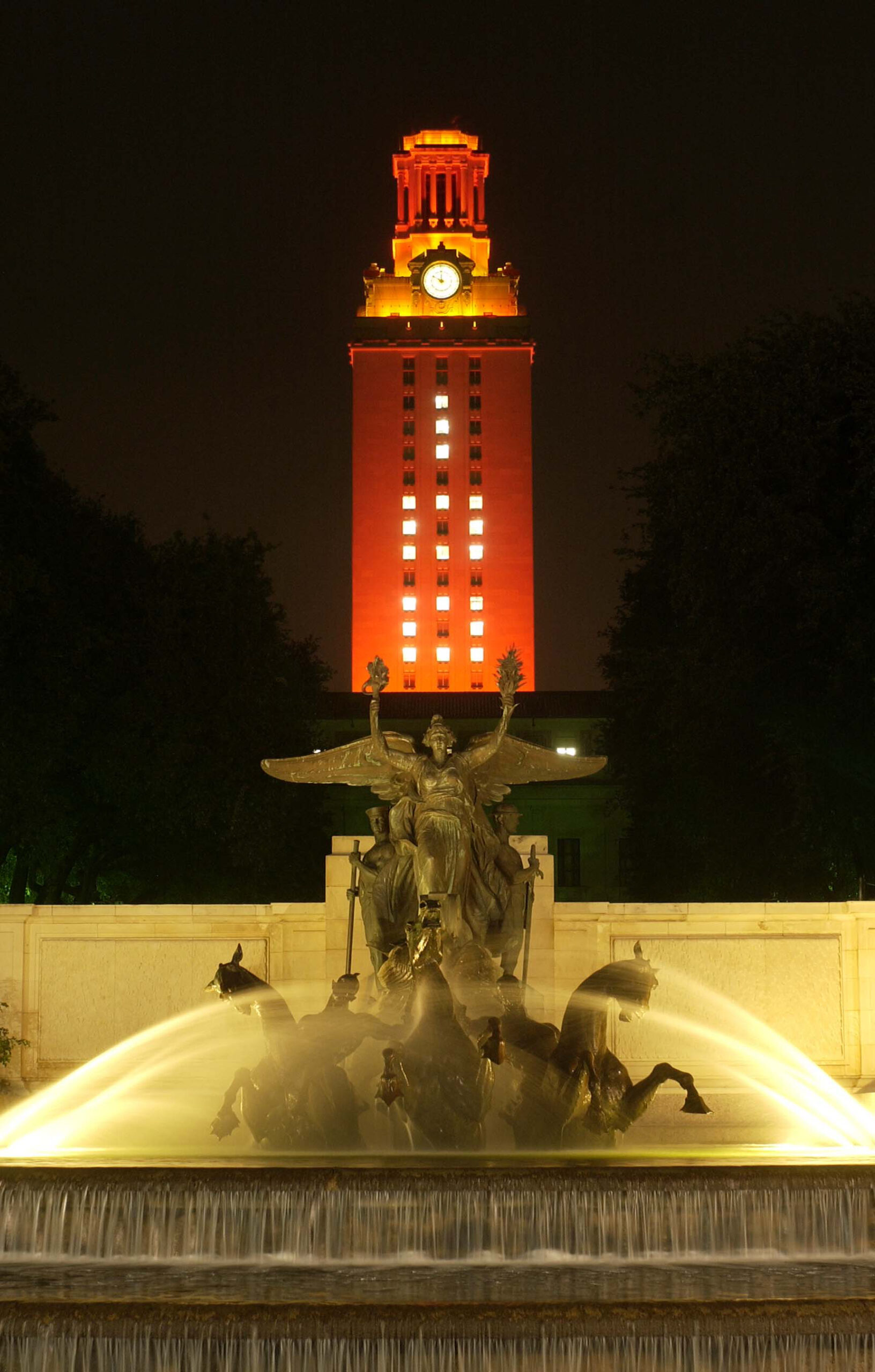 Tower at night with 100 on side